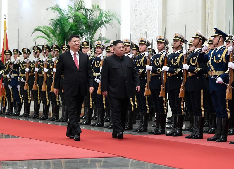 Xi Jinping and Kim Jong-un review an honour guard during a welcome ceremony at the Great Hall of the People in Beijing. AP Photo