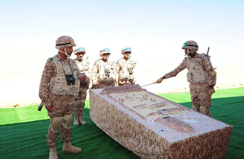Servicemen participate in a training exercise during the graduation ceremony of the 33rd batch of university graduate officers at the Zayed II Military College in Al Ain.