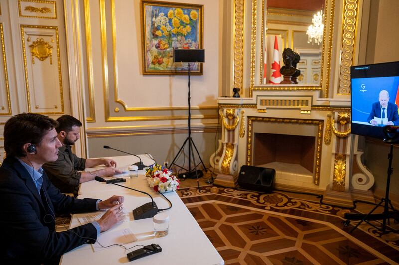 Canadian Prime Minister Justin Trudeau and Ukrainian President Volodymyr Zelenskyy take part in a online meeting of G7 leaders in Kyiv. Reuters