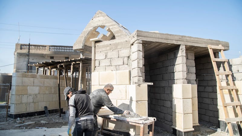 Workers cutting stone to restore Saint Mary Al Tahira church in Qaraqush, Mosul. Haider Husseini