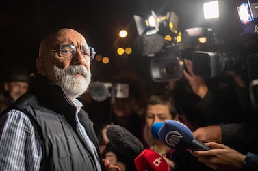Turkish journalist and writer Ahmet Altan speaks to journalists after being released from prison on November 4. AFP