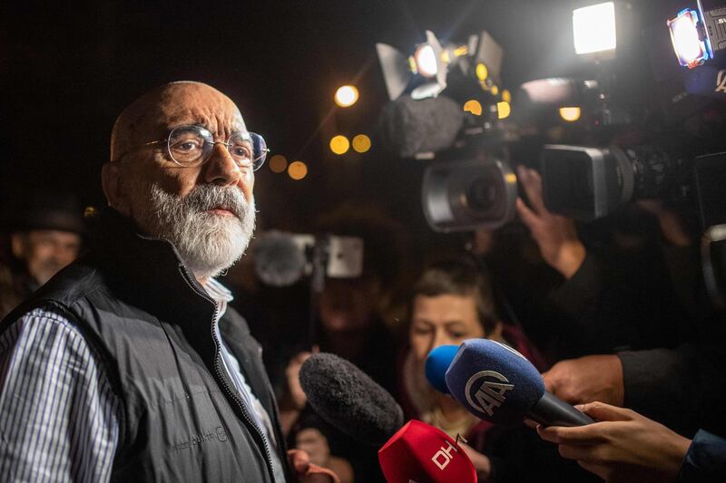 Turkish journalist and writer Ahmet Altan (L) speaks to journalists after being realised on November 4, 2019. A Turkish court ordered journalist Ahmet Altan to be released on November 4, 2019, under judicial supervision despite sentencing him to more than 10 years in prison, state news agency Anadolu reported. He was accused of links to the group blamed for the country's failed coup in 2016. Journalist Nazli Ilicak was also to be released after having her own life sentence overturned, Anadolu said. / AFP / BULENT KILIC
