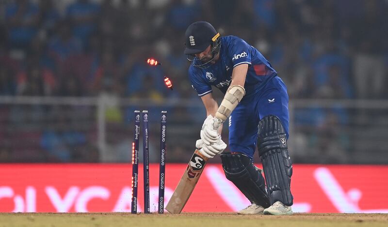 England's Mark Wood is bowled by Jasprit Bumrah of India during their World Cup match in Lucknow. Getty Images