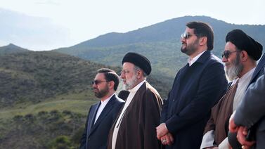 Iran's President Ebrahim Raisi, second left, with members of his delegation at the site of Qiz Qalasi, the third dam jointly built by Iran and Azerbaijan on the Aras River. AFP