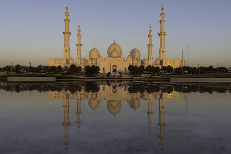 Sheikh Zayed Grand Mosque in Abu Dhabi at sunrise on the first day of Ramadan. Christopher Pike / The National