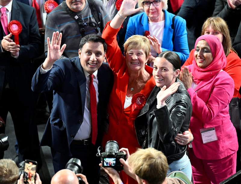 Scottish Labour leader Anas Sarwar celebrates with Maureen Burke after she won in Glasgow North East. Reuters