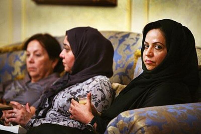 Asma Siddiq, right, and members of the book club in her Al Bateen home.