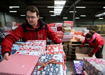 Volunteers of a German charity project pack donated presents in boxes for children in Ukraine and other Eastern European countries, in Muelheim-Kaerlich, Germany, this month. Reuters
