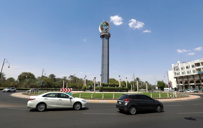 A roundabout in Al Ain featuring a globe and crescent on top of a column.