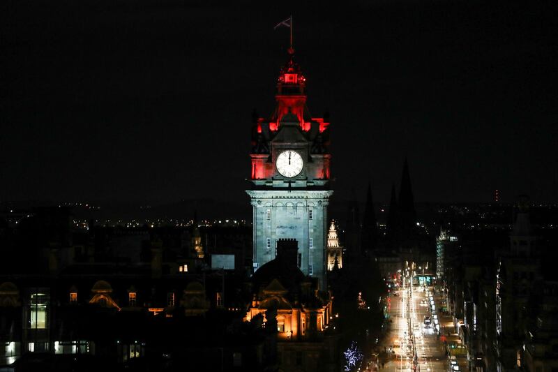A clock face at the Balmoral Hotel is seen at midnight in Edinburg. Reuters