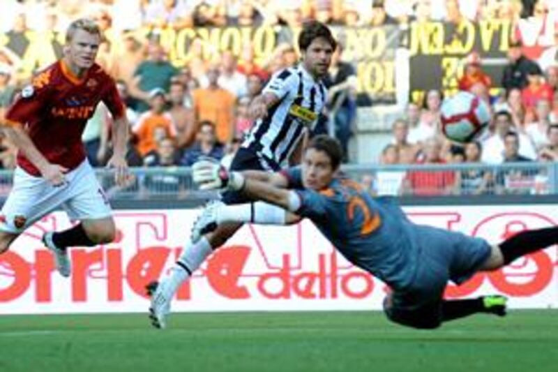 Diego, centre, chips home Juventus' first goal past Roma goalkeeper Julio Bertagnoli at Olimpico stadium in Rome on Sunday.