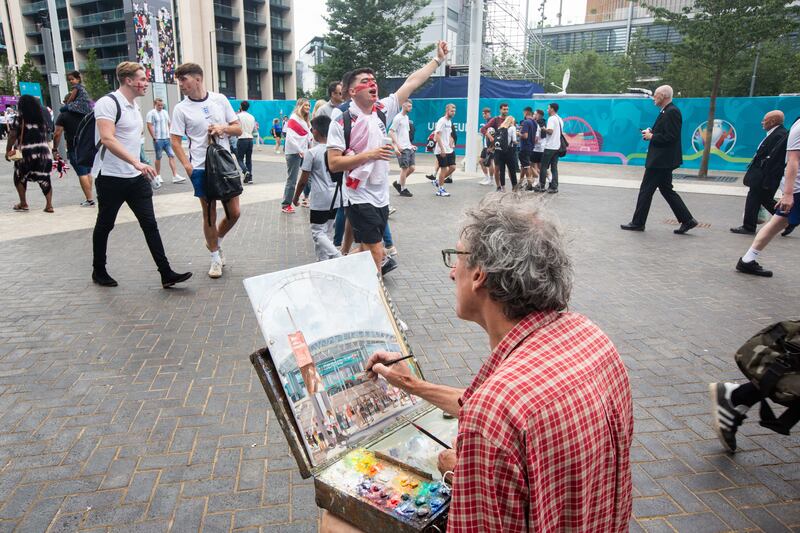 Fans arrive at Wembley stadium ahead of the Euros football final between England and Italy.