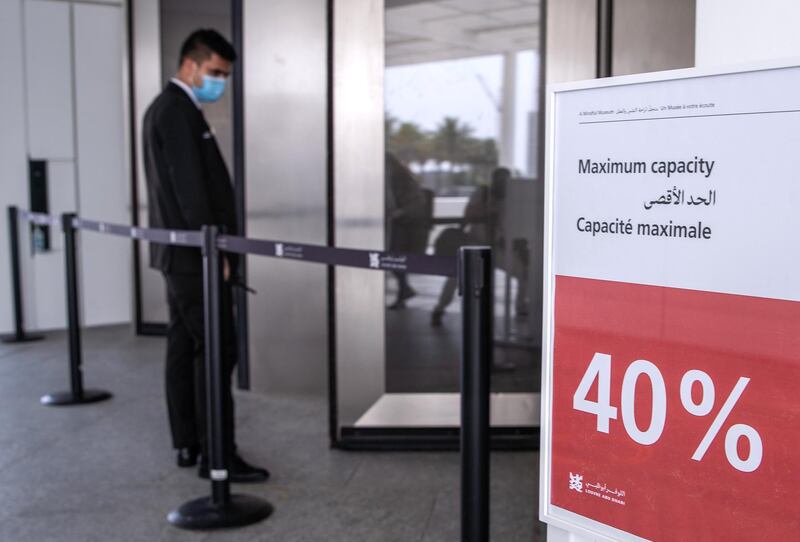 Abu Dhabi, United Arab Emirates, June 25, 2020.   
  Maximum Capacity sign of 40% at the entrance of the Louvre , Abu Dhabi, after 100 days of being temporarily closed due to the Covid-19 pandemic.
Victor Besa  / The National
Section:  NA
Reporter:  Saeed Saeed