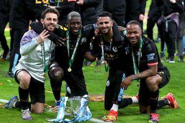 Manchester City's (l to r) Bernardo Silva, Benjamin Mendy, Riyad Mahrez and Raheem Sterling celebrate after winning the League Cup Final at Wembley. PA