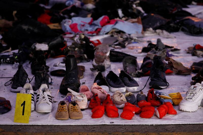 Recovered shoes believed to be from the crashed Lion Air flight JT610 are laid out at Tanjung Priok port in Jakarta, Indonesia, November 1, 2018. REUTERS/Edgar Su