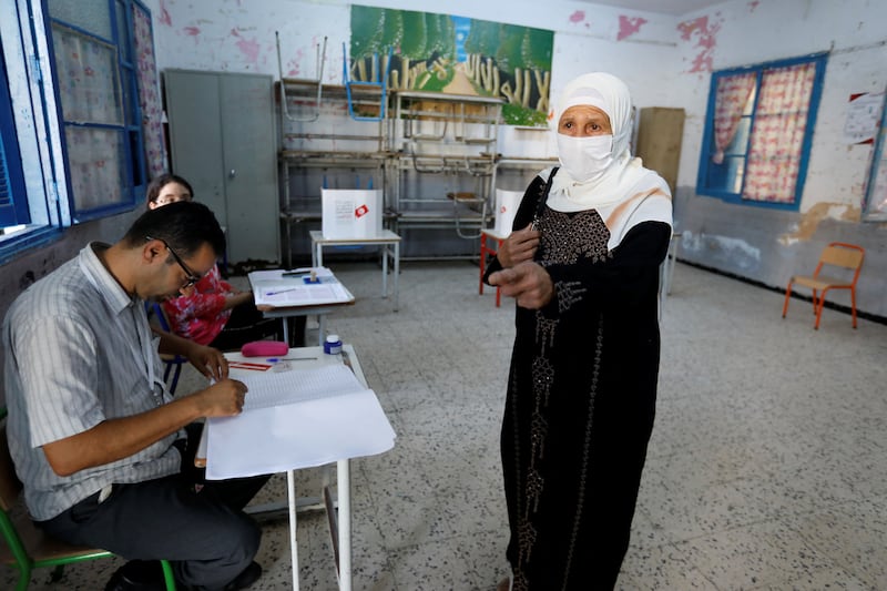 People cast their ballots at a polling station in Tunis on a referendum on a new constitution for Tunisia. Reuters