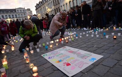 Brussels residents hold a candlelight vigil on November 18 for victims of the Paris attacks, in the suburb of Molenbeek where some of the attackers and suspect Salah Abdeslam lived. Emmanuel Dunand / AFP.