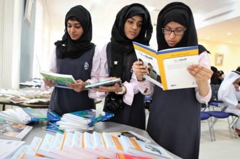 United Arab Emirates - Dubai - April 24, 2011.

ARTS & LIFE: The Princess Haya School for Girls students (left to right) Aisha Hassan Al Mas (cq-al), 18, Khulood Al Falasi (cq-al), 17, and Huda Ahli (cq-al), 17, check out the new books their library received from The Mohammed Rashid Al Maktoum Foundation and the Knowledge and Human Development Authority on Sunday, April 24, 2011. Most of the books were translated from English to Arabic. "I like to visit the library eery week," said Al Falasi. "My favorite hobby is reading books and stories." Amy Leang/The National
