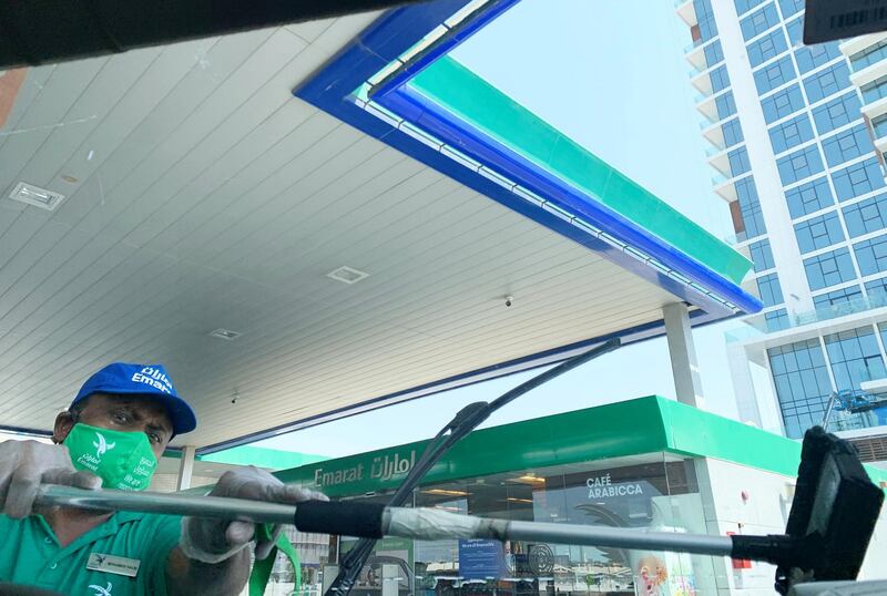 DUBAI, UNITED ARAB EMIRATES , October 10 – 2020 :- Attendant of Emarat gas station wearing protective face mask as a preventive measure against the spread of coronavirus in Dubai. (Pawan Singh / The National) For News/Stock/Online.