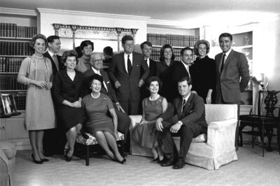Then US president-elect John F Kennedy, centre, is surrounded by members of his family in the living room of the home of Joseph P Kennedy, his father, in 1960. AP Photo