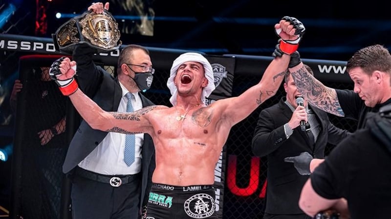 Bruno Machado celebrates after unanimous decision against Frenchman Mickael Lebout to win the UAE Warriors lightweight title in January 2021. Photo: UAE Warriors