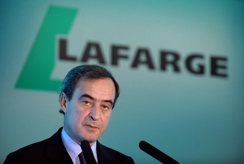 (FILES) This file photo taken on February 17, 2012 shows French cement giant Lafarge CEO Bruno Lafont talking during a press conference to present the group's 2011 results in Paris. 
Two Lafarge officials, including former CEO Bruno Lafont, were indicted December 8 in Paris in an investigation into the financing of the cement of the Islamic State group (IS) in Syria, it was learned from judicial source. Bruno Lafont, CEO of Lafarge from 2007 to 2015, and Christian Herrault, former Deputy Chief Executive Officer, were charged with "financing a terrorist enterprise" and "endangering the lives of others", and placed under control judicial. / AFP PHOTO / ERIC PIERMONT