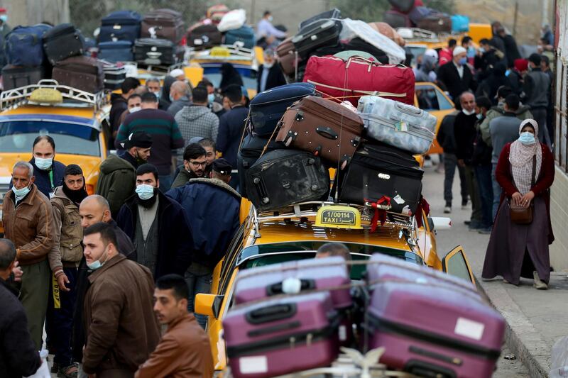 Palestinians gather around cars loaded with suitcases as passengers wait to leave the Rafah border crossing with Egypt, which was reopened partially amid the spread of the coronavirus disease, in the southern Gaza Strip. Reuters