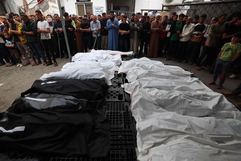 Palestinians mourn relatives killed in the Israeli bombardment of Rafah in the southern Gaza Strip. AFP