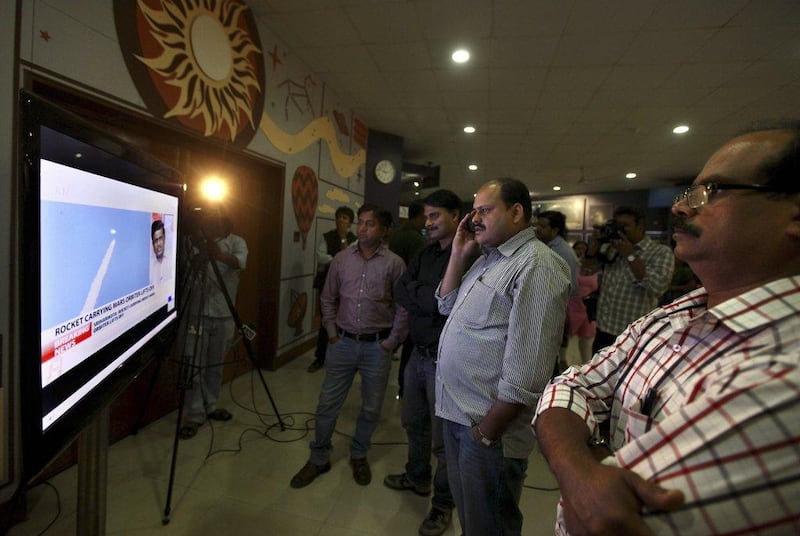 Indians watch the live telecast of the launch of Polar Satellite Launch Vehicle (PSLV-C25) rocket carrying India’s Mars spacecraft from the east-coast island of Sriharikota, in New Delhi, India, in 2013. Photo: AP