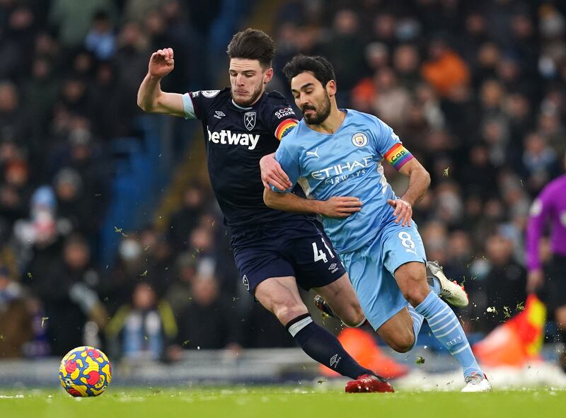 West Ham United's Declan Rice (left) and Manchester City's Ilkay Gundogan battle for the ball. PA