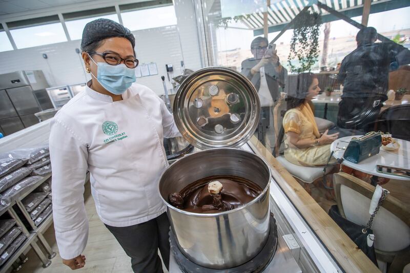 Luchie Suguitan offers a glimpse at how chocolate products are crafted. Leslie Pableo/The National
