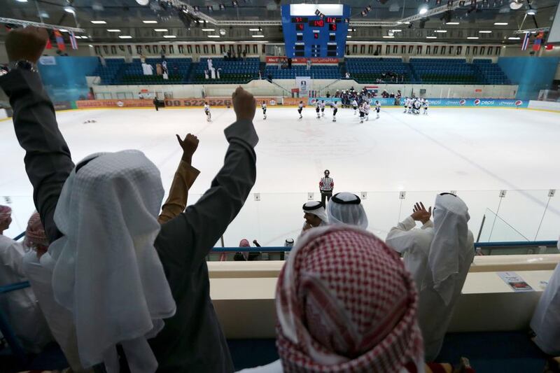 UAE supporters celebrate Saeed Al Nuaimi, not pictured, scoring the winning goal in overtime against Thailand during their Challenge Cup of the Asian Games at the Zayed Sports City Ice Rink on March 17, 2014. Christopher Pike / The National