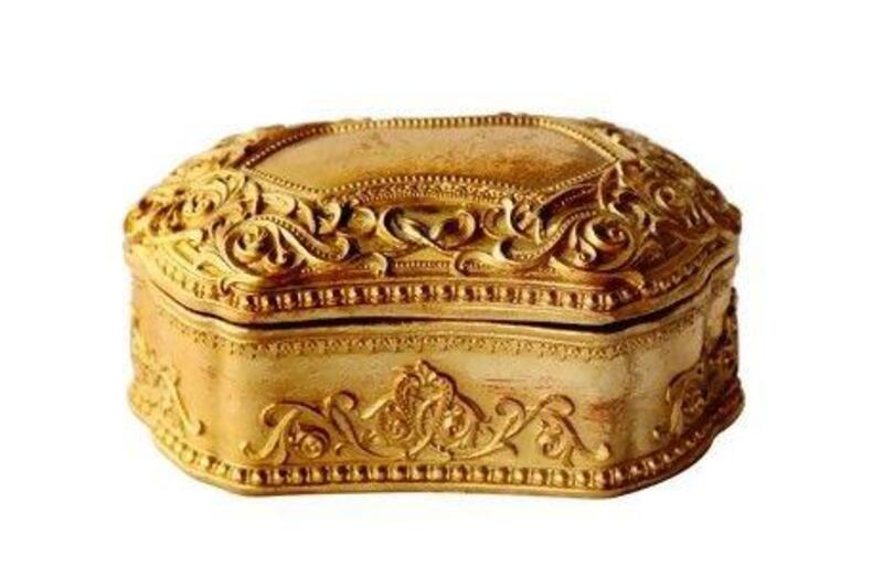 An antique gold jewellery box from 2XL Furniture & Home Decor helps mum keep her bling in order.