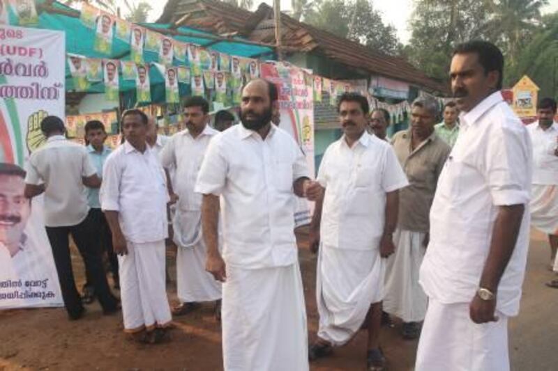 Ernakulam - April 13, 2011 - Non-resident Indian voters foreground L-R Kabeer and Shanawaz Elamana along with contesting candidate Anwar Sadath and his supporters standing infront of a campaigning booth in Aluva Constituency, Kerala. Thulasi Kakkat for The National 