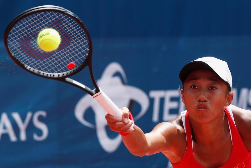 Zhang Shuai of China hits a shot against Wang Qiang of China during the women's singles final. Edgar Su / Reuters