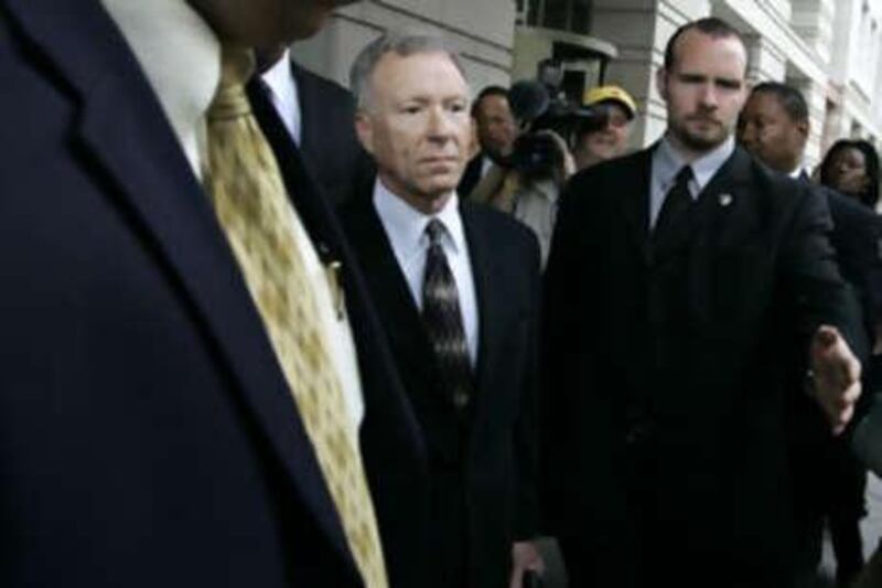 Lewis "Scooter" Libby, a former White House aide, centre, was convicted last year of obstructing a federal leak investigation.