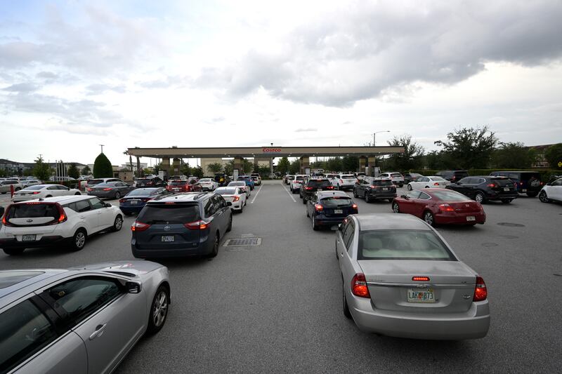 Queues to fill up cars at a Costco Wholesale shop in Orlando as Hurricane Ian approaches. AP Photo