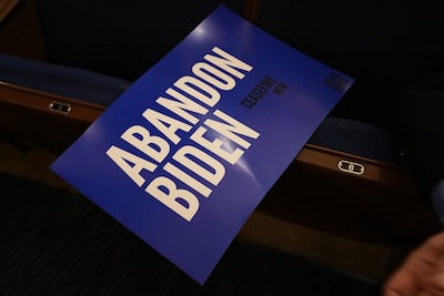 A placard reads 'Abandon Biden' at a pro-Palestine rally in the US state of Michigan