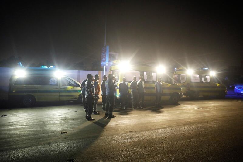Ambulance workers are seen following a fire that broke out in Egypt's Shuqair-Mostorod crude oil pipeline, at the beginning of Cairo-Ismailia road, Egypt. REUTERS