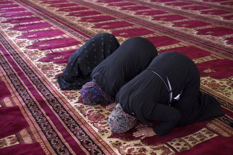 Palestinian women pray inside of the Sheikh Khalifa bin Zayed Mosque, in Izzariya, in the outskirts of Jerusalem (Photo for The National by Heidi Levine).
