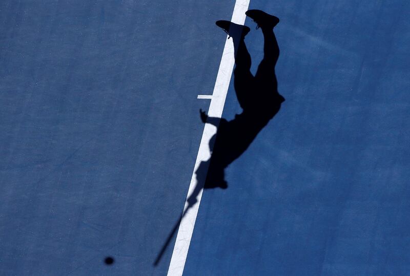 Simona Halep serves against Destanee Aiava. Thomas Peter / Reuters