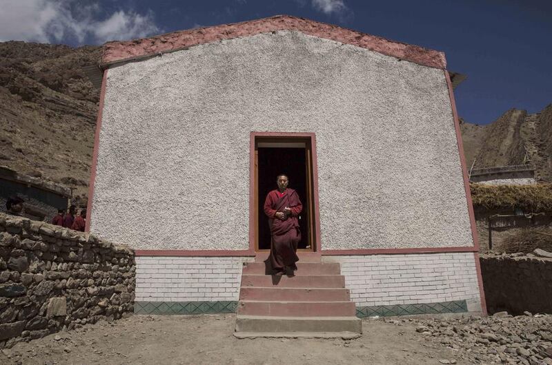 A Buddhist monk from the Drukpa lineage leaves a polling station after voting near the Hemis Monastery.