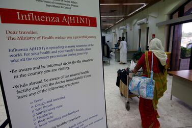 A swine flu warning sign at Salalah airport, Oman, in 2009. The swine flu epidemic that year killed tens of thousands of people across the globe. Stephen Lock / The National