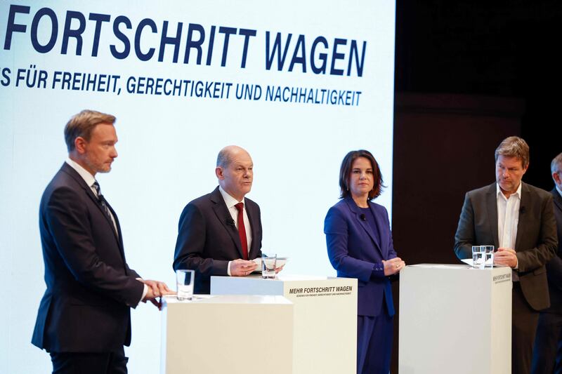 Left to right: Christian Lindner, Olaf Scholz, and the co-leaders of Germany's Greens, Annalena Baerbock and Robert Habeck, attend a press conference in Berlin to present their deal for a post-Merkel government. AFP