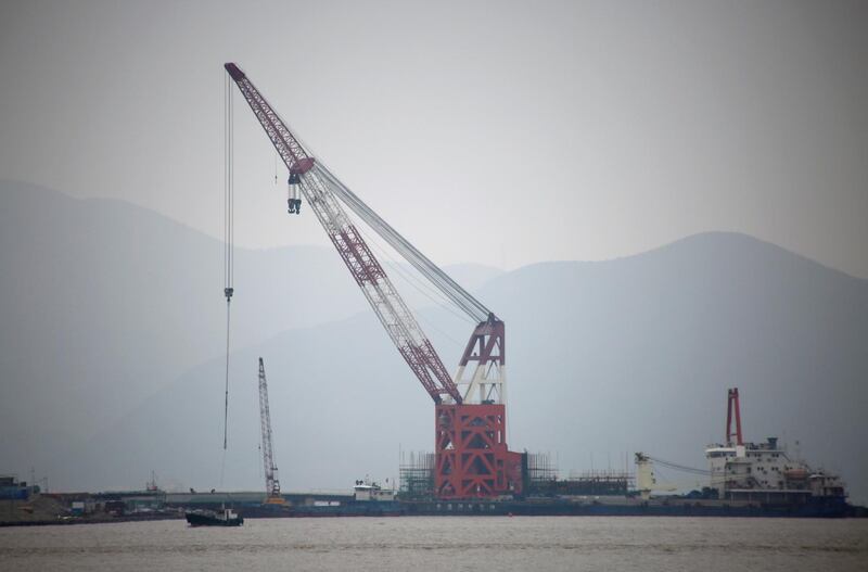 FILE PHOTO: A crude oil terminal under construction is pictured off Ningbo Zhoushan port in Zhejiang province, China January 6, 2018. Picture taken January 6, 2018. REUTERS/Stringer/File Photo ATTENTION EDITORS - THIS IMAGE WAS PROVIDED BY A THIRD PARTY. CHINA OUT.