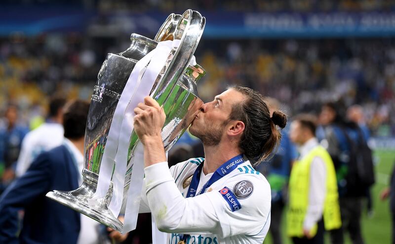 Gareth Bale kisses the Uefa Champions League trophy following Real Madrid's win over Liverpool at NSC Olimpiyskiy Stadium in Kyiv on May 26, 2018. Getty