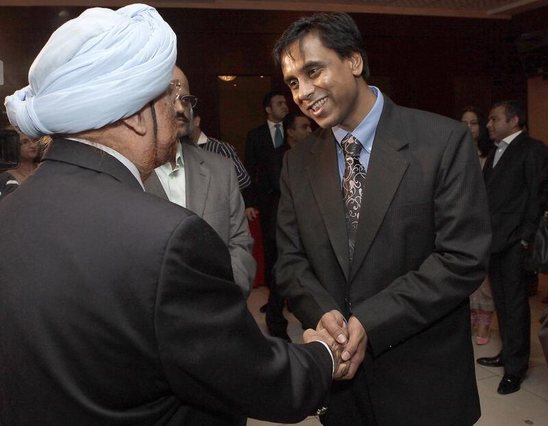 Anurag Bhushan, the new Indian consul general, right, meets business leaders in Dubai this week. Jeffrey E Biteng / The National