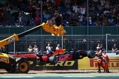 NORTHAMPTON, ENGLAND - JULY 06:  The car of Max Verstappen of Netherlands and Red Bull Racing is removed from the circuit after he crashed during practice for the Formula One Grand Prix of Great Britain at Silverstone on July 6, 2018 in Northampton, England.  (Photo by Charles Coates/Getty Images)