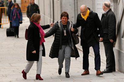 Former Catalan Parliament Speaker Carme Forcadell, left, separatist politician Dolors Bassa, center and former Cabinet member Raul Romeva arrive at the Supreme Court in Madrid, Friday, March 23, 2018. A Spanish Supreme Court probe into last year's attempt to secede Catalonia from Spain wraps Friday with the judge issuing indictments and possible rebellion and other charges for various regional politicians and separatist leaders and signaling that he may issue for the latter preventive measures that could include pre-trial jailing. (AP Photo/Francisco Seco)