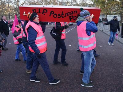 Members of the Communication Workers Union carrying a coffin in procession from Parliament Square to Buckingham Palace, London, on Friday. PA Wire
